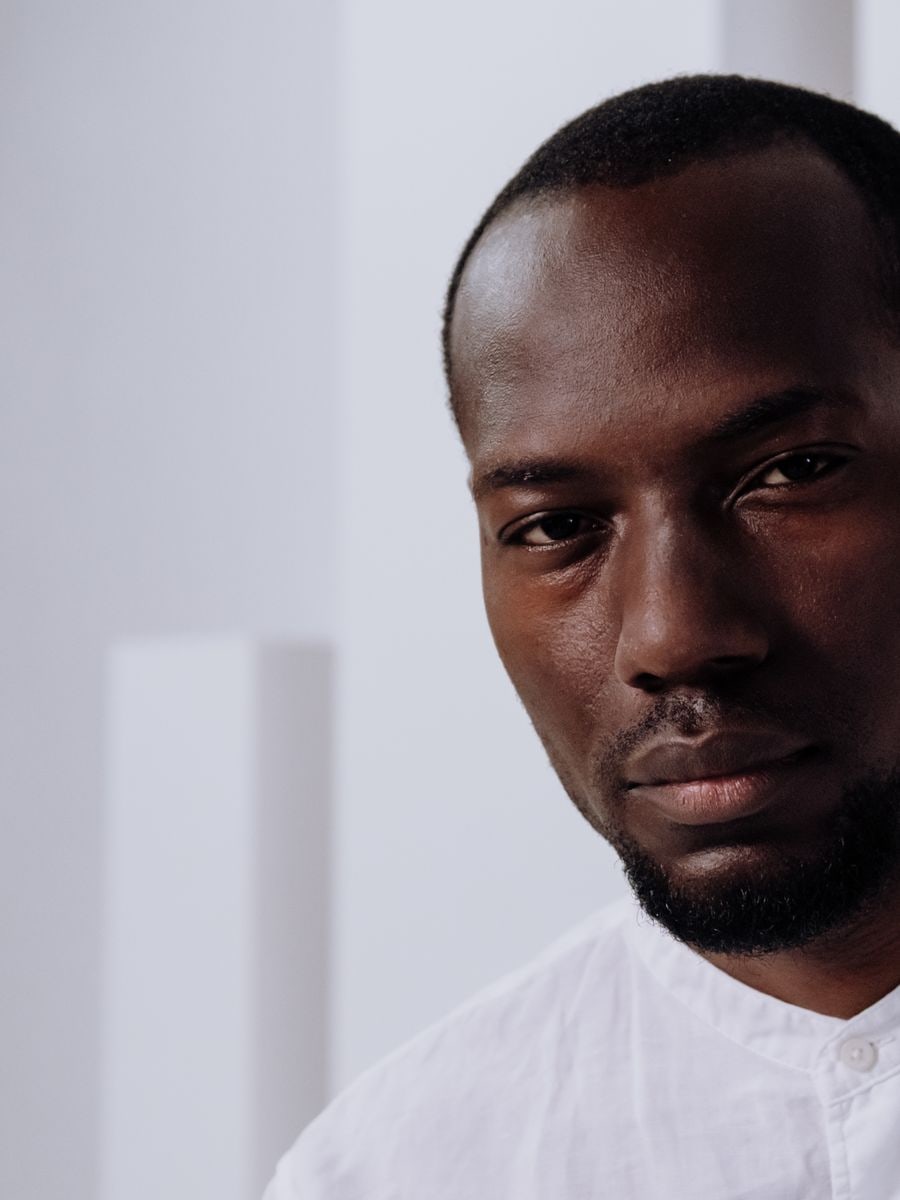 Male model with deep skin and a radiant complexion